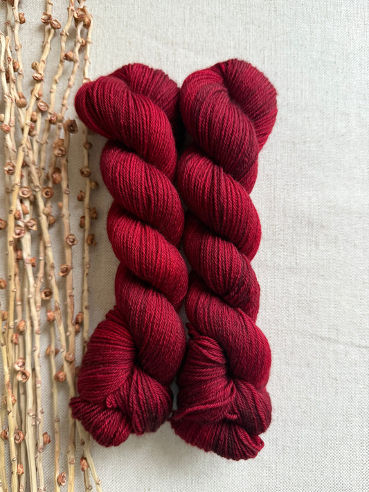 Blackened Poinsettia SW Merino Nylon 50g Skein